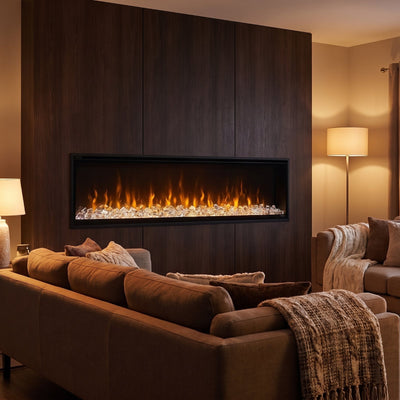 Dimplex IgniteXL 60 linear electric fireplace burning in a dark wood feature wall at evening