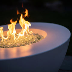 Close-up of flames in the white AFD Calais Oval fire table