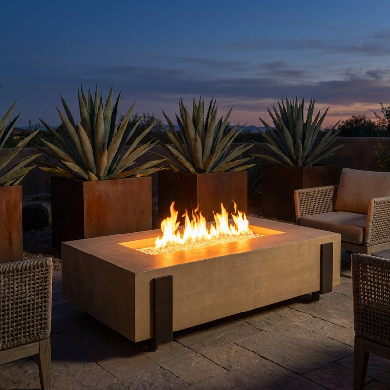 AFD Iron Saddle fire table in Cafe Blanco burning on a desert patio at dusk