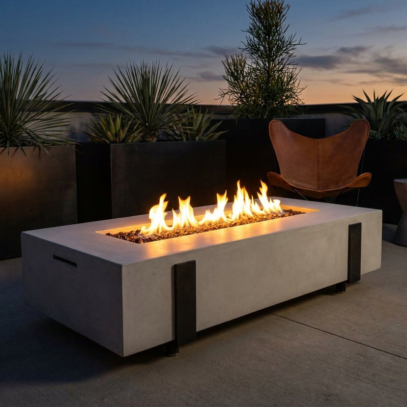AFD Iron Saddle Long fire table with strap legs burning on a terrace at dusk