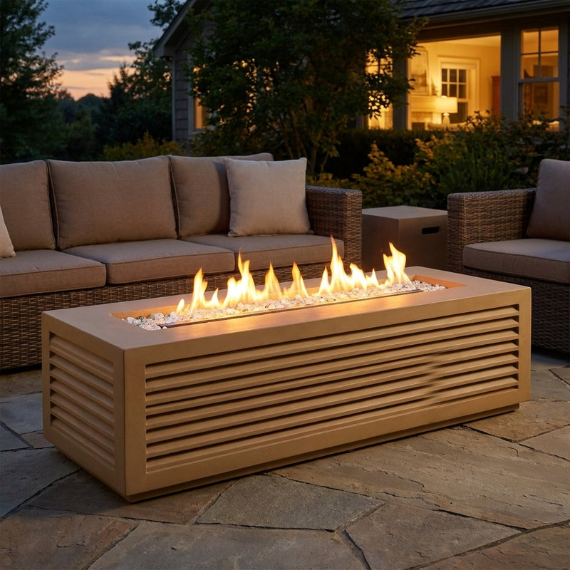 AFD Louvre Long Rectangle fire pit with louvered sides burning on a flagstone patio at dusk