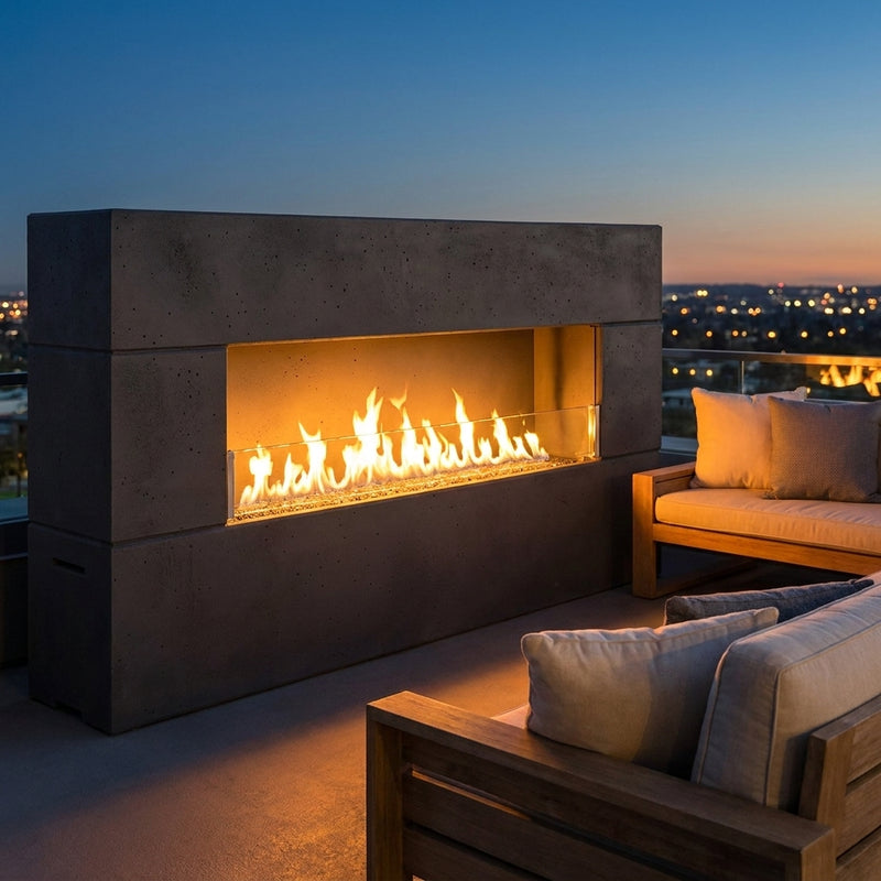 American Fyre Designs Milan Low linear outdoor fireplace in Black Lava on a rooftop at dusk