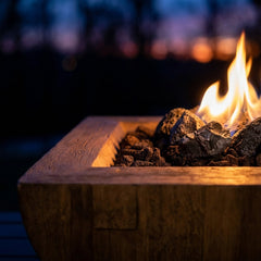 Close-up of flame over lava rock in the AFD Bordeaux Square fire bowl