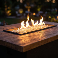 Close-up of the flame and wood-grain top of the AFD Cosmopolitan Rectangle fire table