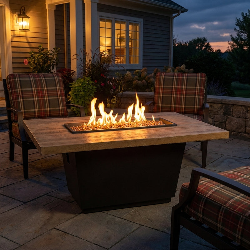 AFD Reclaimed Wood Cosmopolitan Rectangle fire table burning on a family patio at dusk