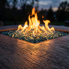 Close-up of flames and wood-grain concrete top of the AFD Cosmopolitan Square fire table