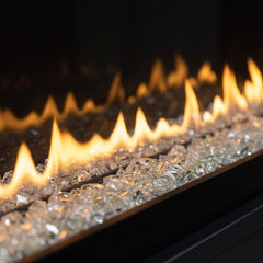 Flame detail: Dimplex Ignite Evolve 74 slim built-in linear electric fireplace glowing in an evening interior