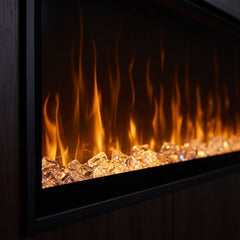 Close detail of the Dimplex IgniteXL 60 clear crystal ember bed and amber LED flame effect