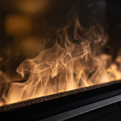 Flame detail: Dimplex 46 Opti-myst linear electric fireplace with water-vapor flame in a marble bathroom wall at evening