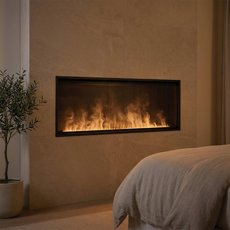 Dimplex 66 inch Opti-myst linear electric fireplace with water-vapor flame recessed in a limestone wall at evening