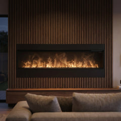 Dimplex 86 inch Opti-myst linear electric fireplace with water-vapor flame built into a dark oak media wall at evening