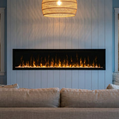 Dimplex Ignite XL 74 built-in linear electric fireplace in a coastal paneled wall at evening