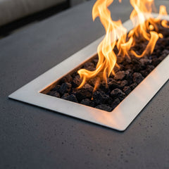 Close-up of flames over lava rock in the Elementi Granville's stainless steel burner