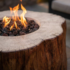Close-up of flames over lava rock in the Elementi Manchester's ring-cut concrete stump top