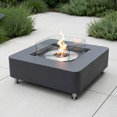 Slate black Elementi Perth ethanol fire table on a bright patio in neutral daylight