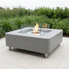 Space gray Elementi Perth ethanol fire table on a bright patio in neutral daylight
