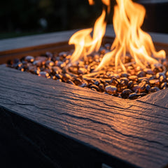 Close-up of flames and striated sandstone texture on the Elementi Plus Roraima fire pit table