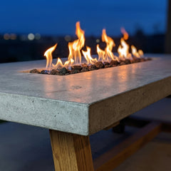 Close-up of the linear gas flame over lava rock in the Elementi Sonoma concrete tabletop