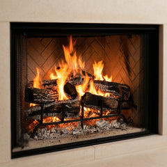 Flame detail: Majestic Biltmore 42 wood burning fireplace with herringbone brick interior burning in a limestone surround