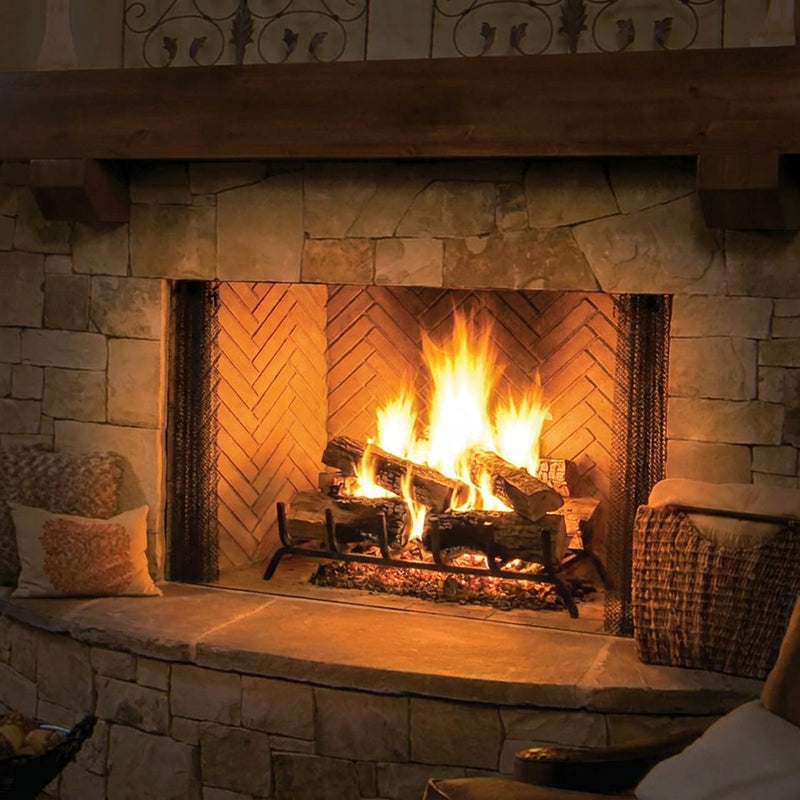 Majestic Biltmore 50 wood burning fireplace with herringbone brick interior blazing in a stone chimney