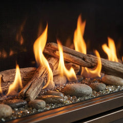 Driftwood logs and river rock media burning inside the Majestic Echelon II 60