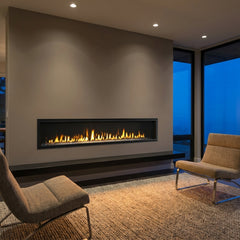 Majestic Echelon II 72 linear direct vent gas fireplace burning in a modern great room at dusk