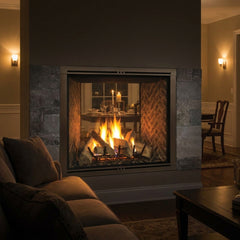 Majestic Marquis II 42 see-through gas fireplace burning in a room-dividing wall at night