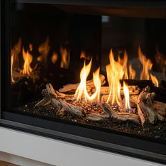 Flame detail: Majestic Meridian 36 Modern gas fireplace with reflective black glass interior in a plaster wall, burning
