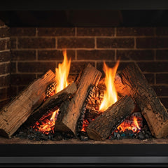 Flame detail: Majestic Meridian 36 NG direct vent gas fireplace with log set, burning at evening