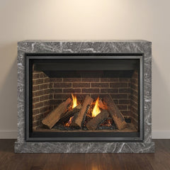 Majestic Meridian 42 NG direct vent gas fireplace with log set installed in a stone surround, burning at evening