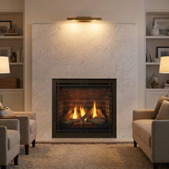 Majestic Quartz Platinum 36 direct vent gas fireplace in a marble surround, burning at evening