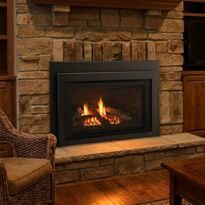 Majestic Ruby 35 direct vent gas insert burning in an existing masonry fireplace at night