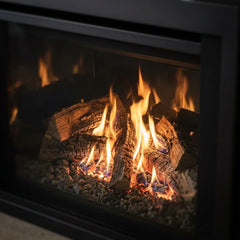 Split log fire behind the glass of the Majestic Ruby 35 insert