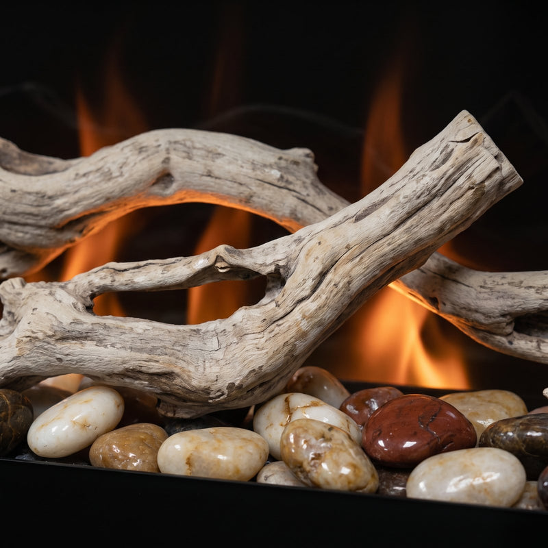 Dimplex driftwood and river rock media kit for 50 inch linear fireplace, close-up shown lit